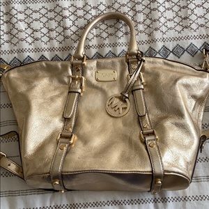 Gently used gold Michael Kors purse
